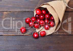 Red ripe cherry in a paper bag