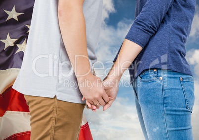 Part of a couple giving hands to each other against 3d american flag