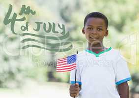 Green fourth of July graphic next to boy holding american flag