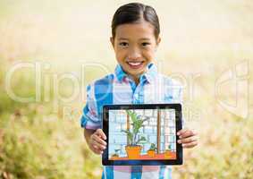 boy showing the house with tablet