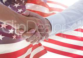 people shaking their hands against american flag