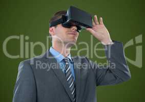 Man in virtual reality headset against green background