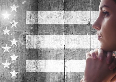Woman thinking against black and white american flag
