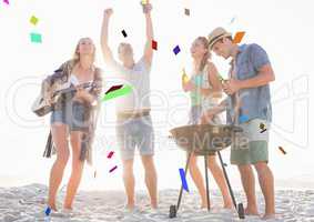 Confetti against millennials at beach party