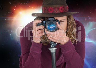 Photographer taking picture in colored lights background