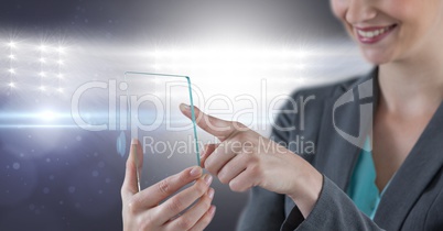 Part of a woman touching a 3d glass screen