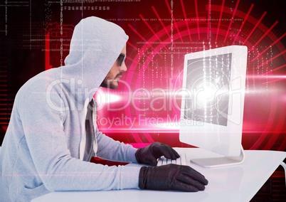 Hacker with sunglasses using a laptop in front of digital red background