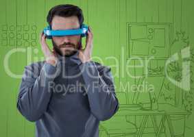 Man in blue virtual reality headset against green hand drawn office