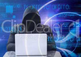 Shadow of hacker with sweatshirt using a laptop in front of blue digital background