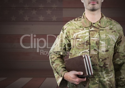 Military holding books against 3D american flag