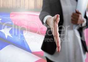 Business woman shaking her hand against american flag