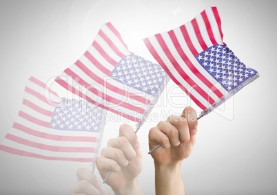 Hand shaking american flags