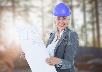 Middle aged business woman on blurry building site