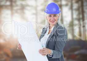 Middle aged business woman on blurry building site