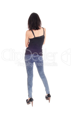 Woman standing in tights from the back.