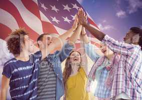 American Flag with young people high five hands together