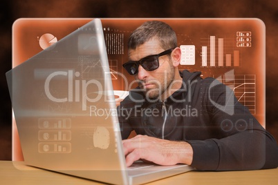 Hacker using a laptop on orange interface