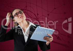 Frustrated business woman with tablet against maroon background and graph