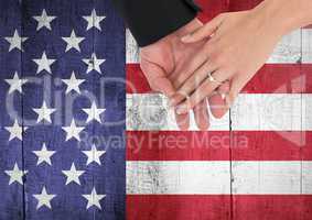 Couple with hands together  against american flag