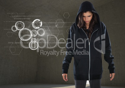 Woman hacker standing on in front of grey background with digital graphics