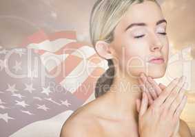 Woman closing her eyes against american flag