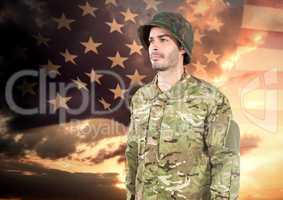 Happy soldier standing on american flag background