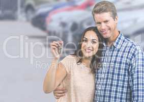 Couple Holding Keys with cars