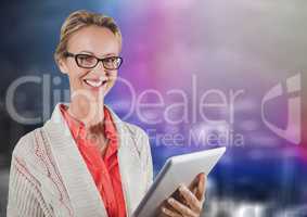 Woman with tablet against blurry purple wall with city doodle