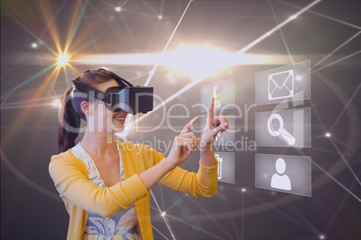 Composite image of woman using virtual reality