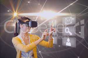Composite image of woman using virtual reality