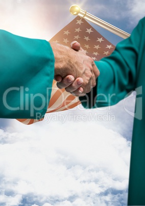 Senior people shaking their hands against american flag