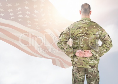 Back view of soldier in front of white background with american flag