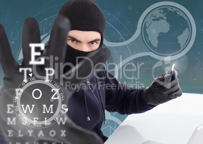 Hacker holding a credit card and extending his arm in front of digital background