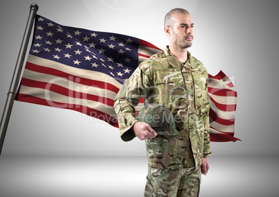 military standing against american flag