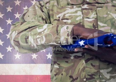 Military holding american flag against american flag