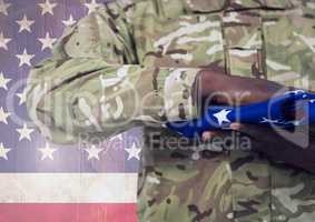 Military holding american flag against american flag