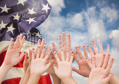 Hands up against fluttering american flag