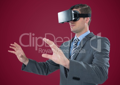 Man in virtual reality headset against maroon background
