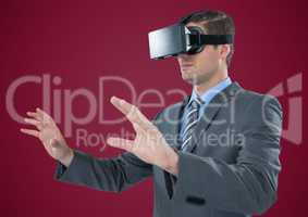 Man in virtual reality headset against maroon background
