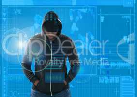 hacker with arms in pocket in front of blue digital background