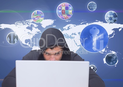Hacker using a laptop in front of digital background with graphics ans mapworld