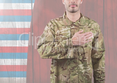 Smiling soldier putting his hand on his heart for independence day