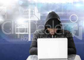 Hacker using a laptop in front of blue digital background