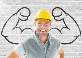 happy worker with hat in front of fists draw on the bricks wall