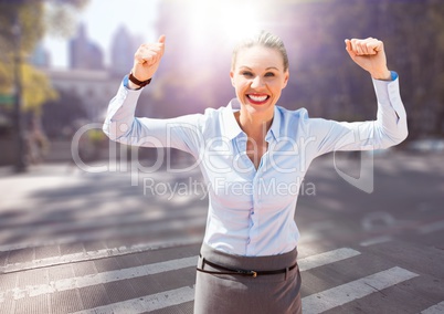 Business woman hands in air on blurry street with flares