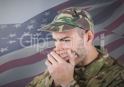 Soldier hiding his mouth with his hands in front of american flag