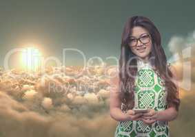 Smiling woman texting against 3D cloudy sky with sun background