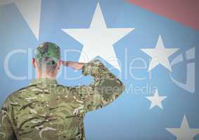 Back view of a soldier in front of american flag