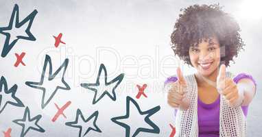 Millennial woman giving two thumbs up against white wall with red and blue hand drawn star pattern a