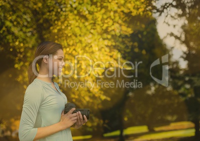 photographer with camera in the park. Blurred lights.